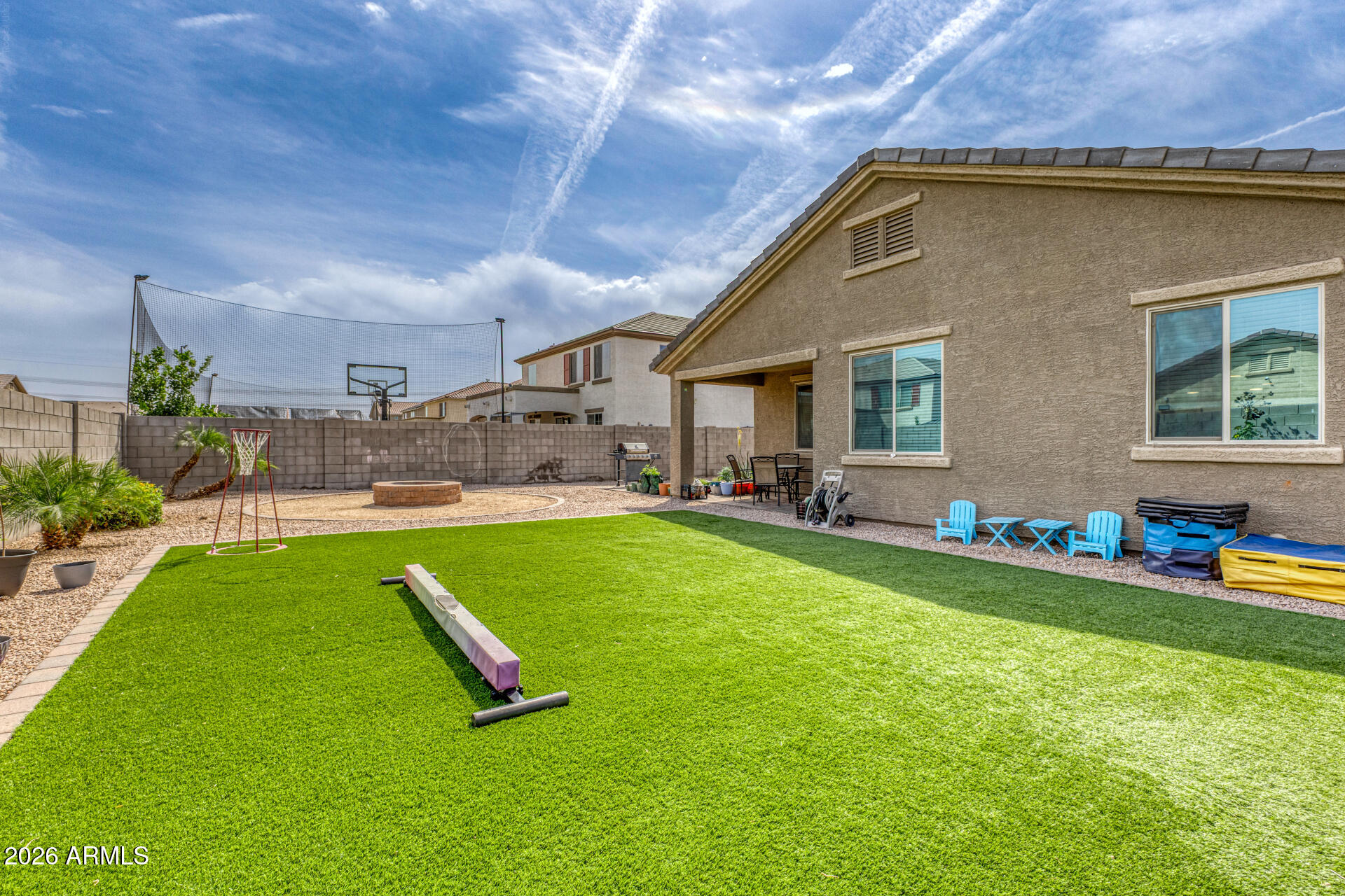 12214 West Del Rio Lane Avondale, AZ 85323 - Photo 31 of 32 a front view of house with yard and outdoor seating