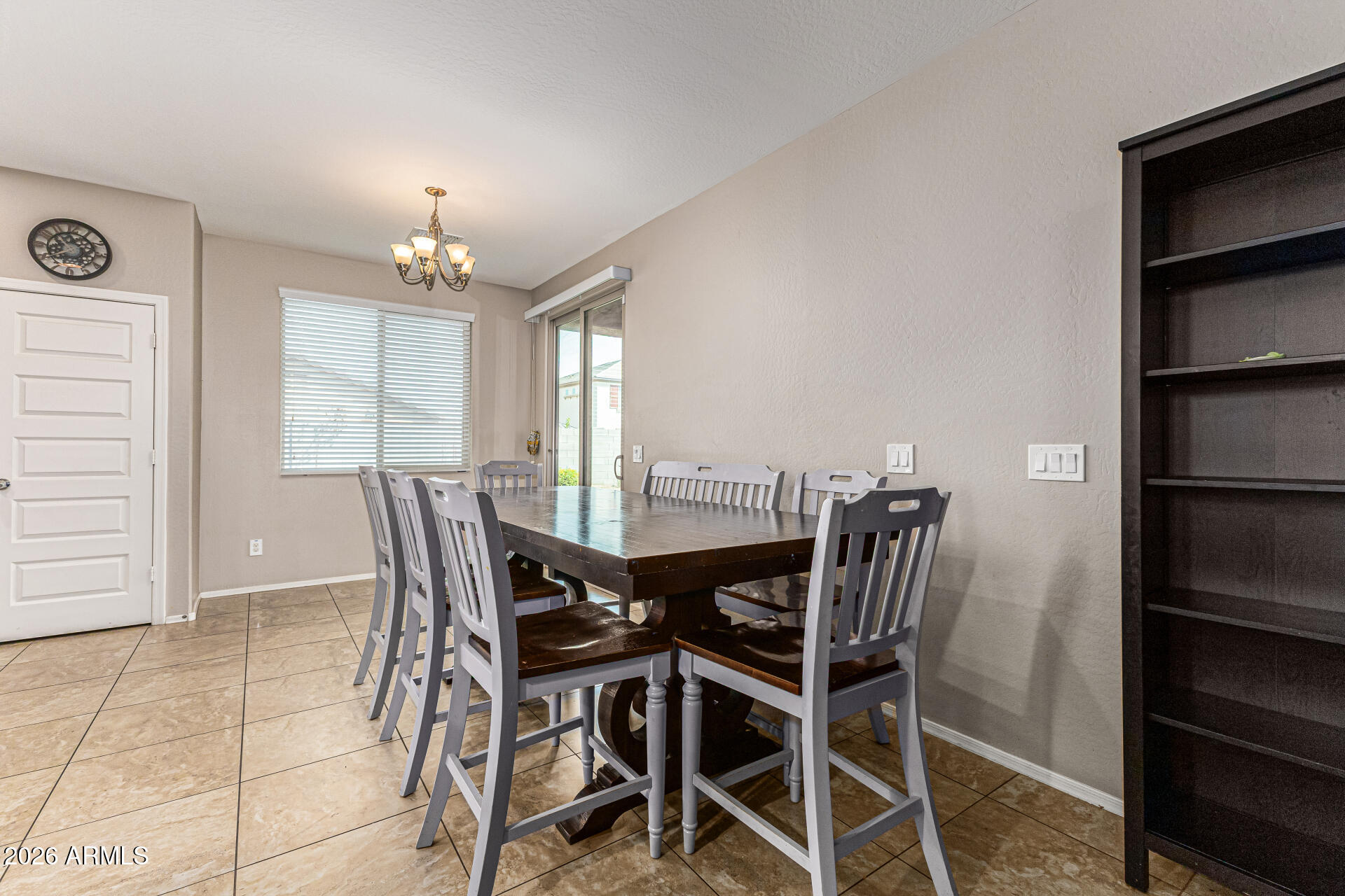 12214 West Del Rio Lane Avondale, AZ 85323 - Photo 8 of 32 a view of a dining room with furniture and window