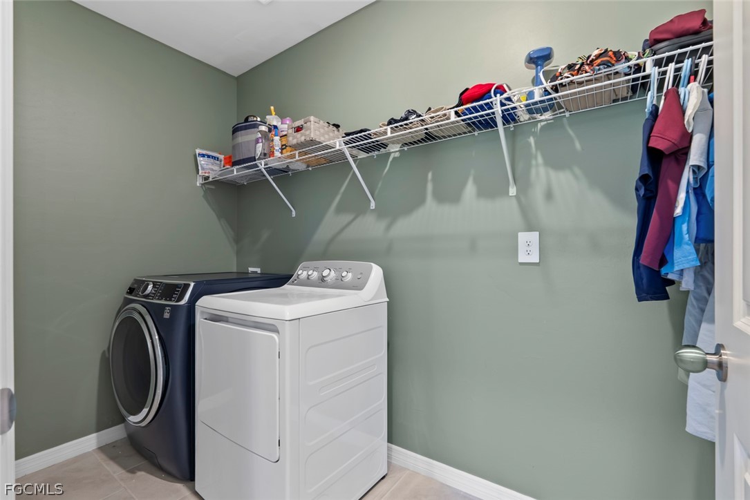 19972 Green Pasture Road Lehigh Acres, FL 33974 - Photo 16 of 48 a utility room with dryer and washer