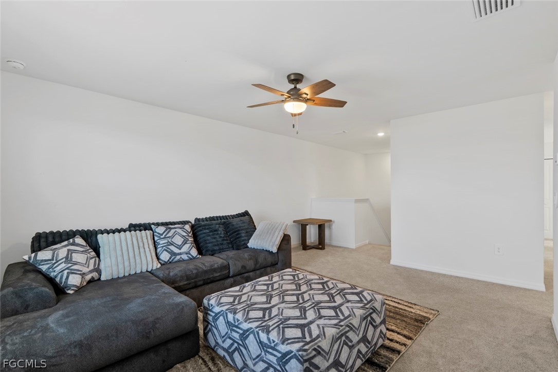 19972 Green Pasture Road Lehigh Acres, FL 33974 - Photo 22 of 48 a bedroom with a bed and a couch
