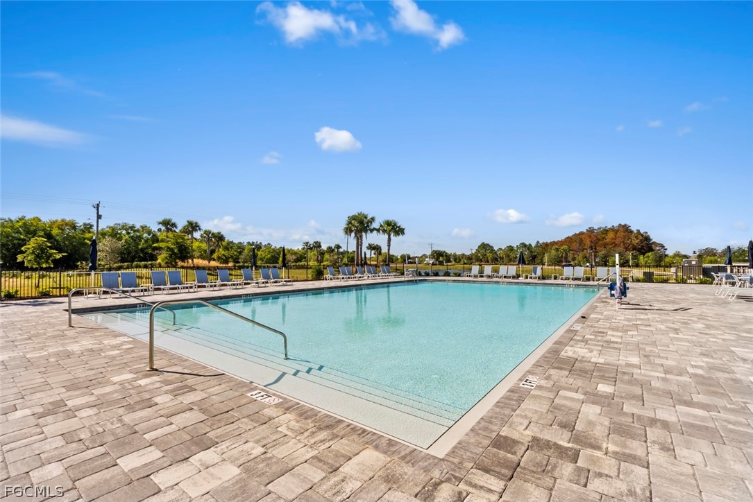 19972 Green Pasture Road Lehigh Acres, FL 33974 - Photo 31 of 48 a view of a lake with a outdoor space