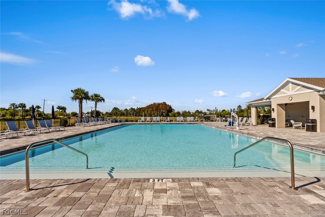 19972 Green Pasture Road Lehigh Acres, FL 33974 - Photo 32 of 48 a view of a lake with a outdoor space