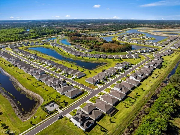 an aerial view of a pool patio swimming pool and outdoor seating
