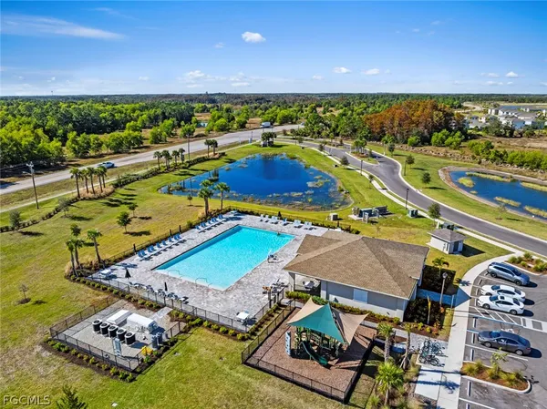 an aerial view of a house with a swimming pool