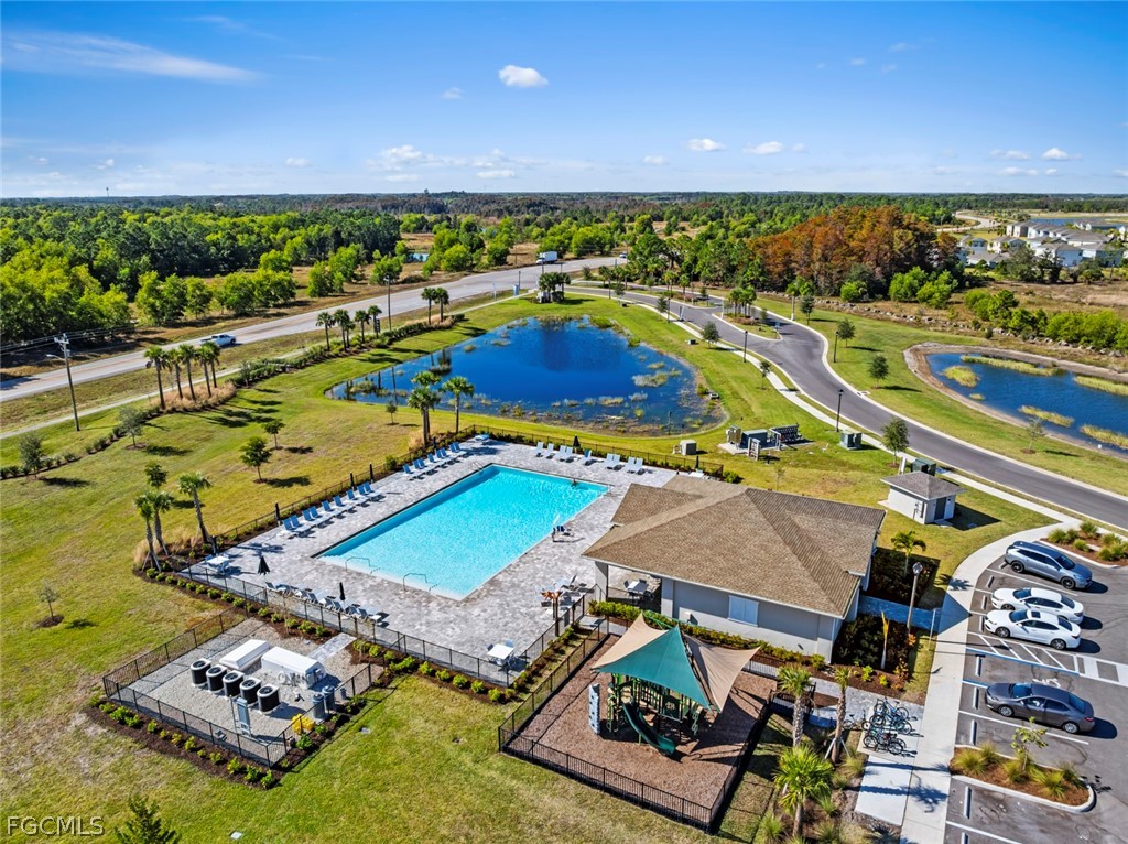 19972 Green Pasture Road Lehigh Acres, FL 33974 - Photo 36 of 48 an aerial view of a pool patio swimming pool and outdoor seating