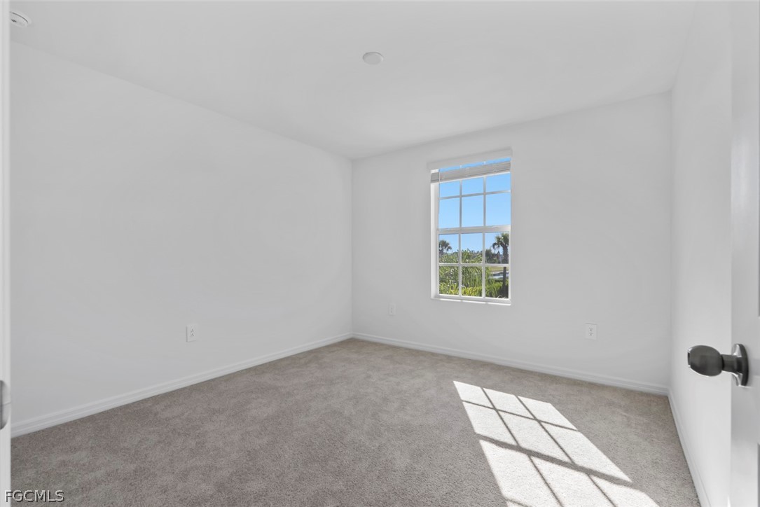 19972 Green Pasture Road Lehigh Acres, FL 33974 - Photo 37 of 48 a view of an empty room with a window
