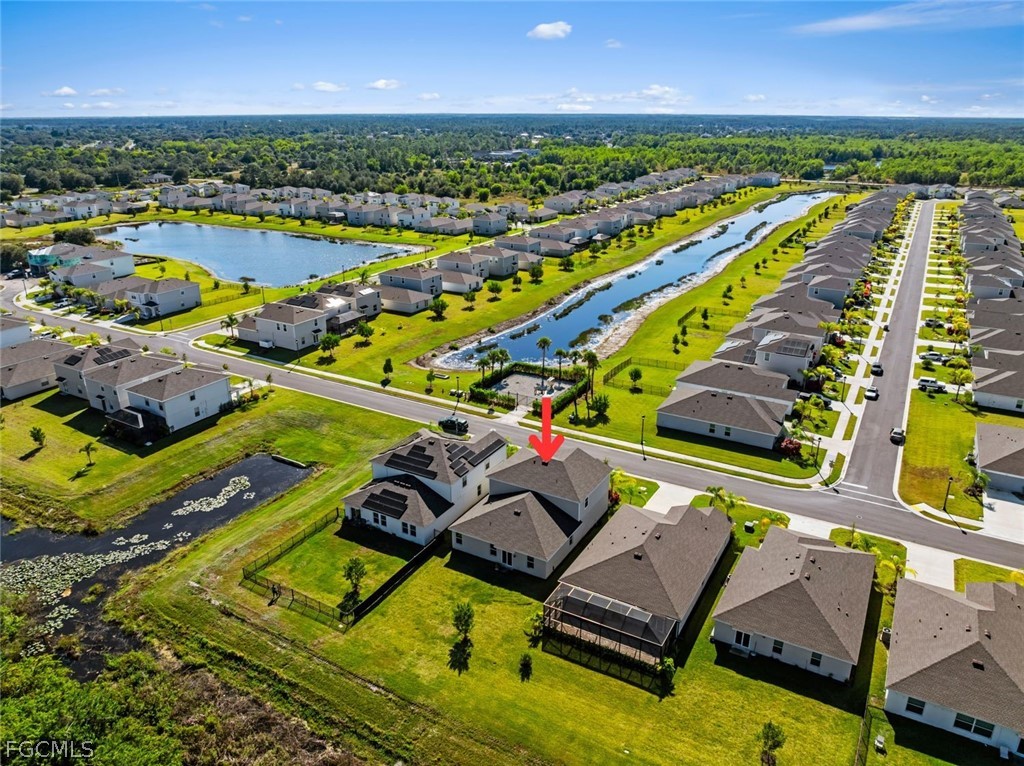 19972 Green Pasture Road Lehigh Acres, FL 33974 - Photo 39 of 48 an aerial view of a pool patio yard and outdoor seating