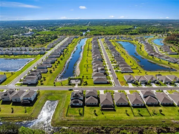 an aerial view of a pool patio swimming pool and outdoor seating