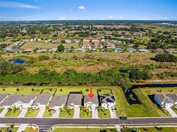 an aerial view of a pool table and chairs