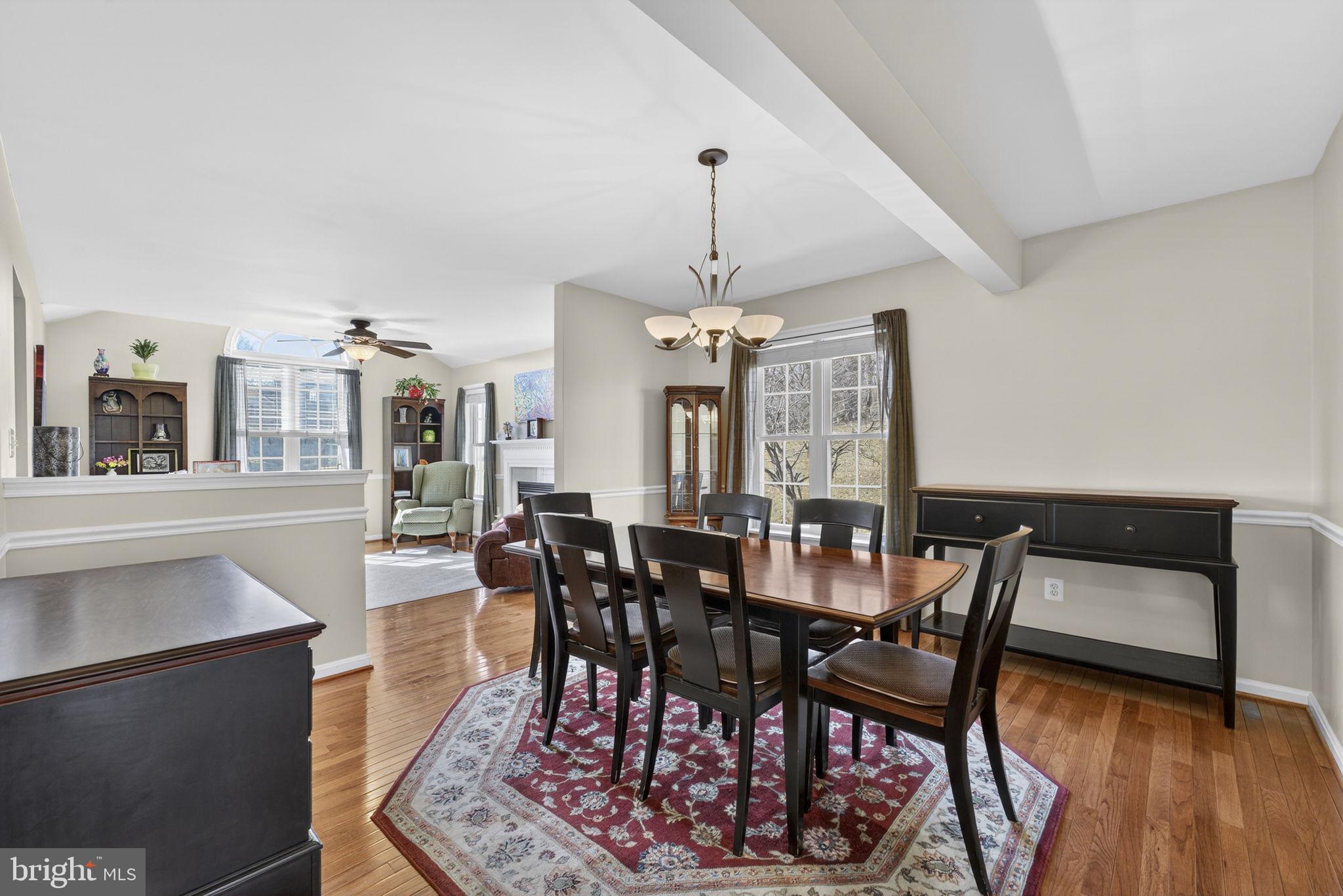 12376 Robin Road Culpeper, VA 22701 - Photo 18 of 70 a view of a dining room with furniture and wooden floor