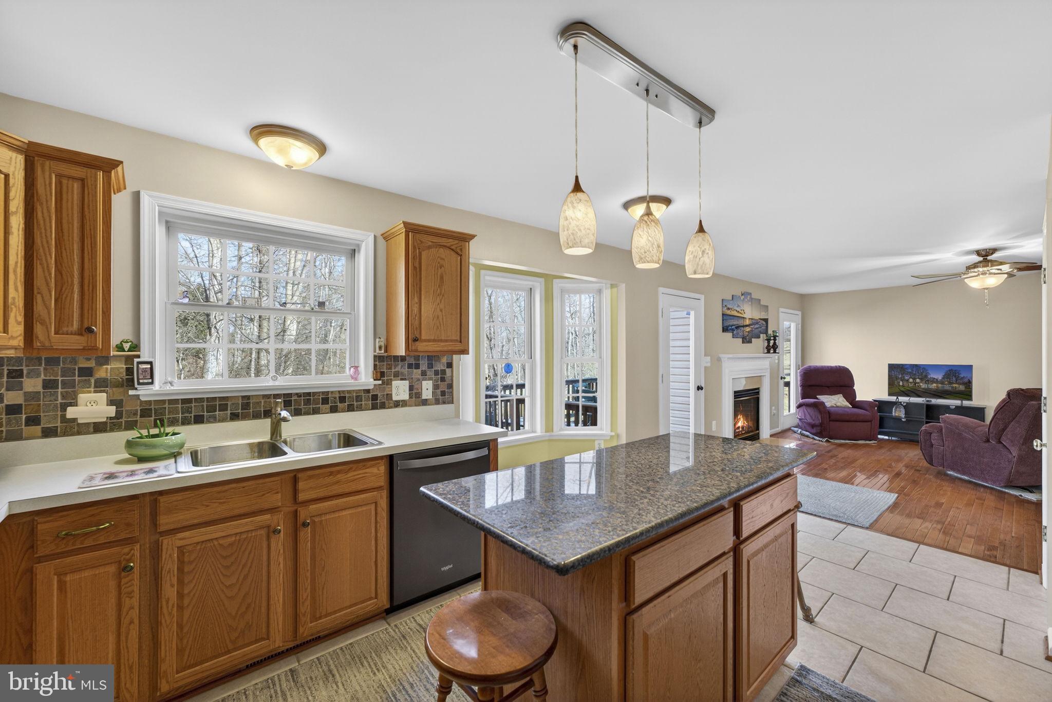12376 Robin Road Culpeper, VA 22701 - Photo 37 of 70 a kitchen with a sink a counter space appliances and cabinets