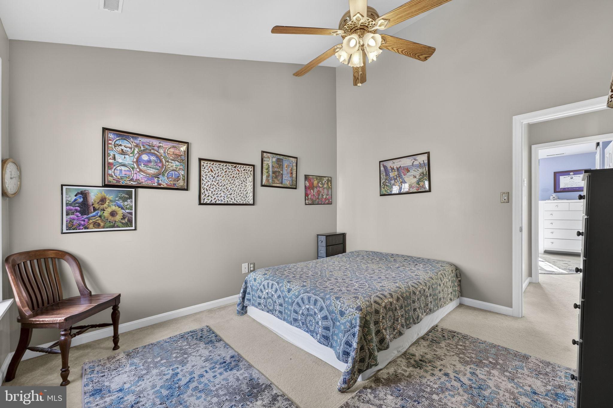 12376 Robin Road Culpeper, VA 22701 - Photo 47 of 70 a bedroom with a bed and a chair