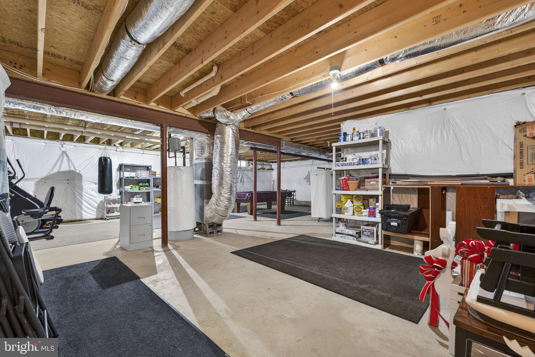12376 Robin Road Culpeper, VA 22701 - Photo 51 of 70 a living room with lots of furniture and a chandelier