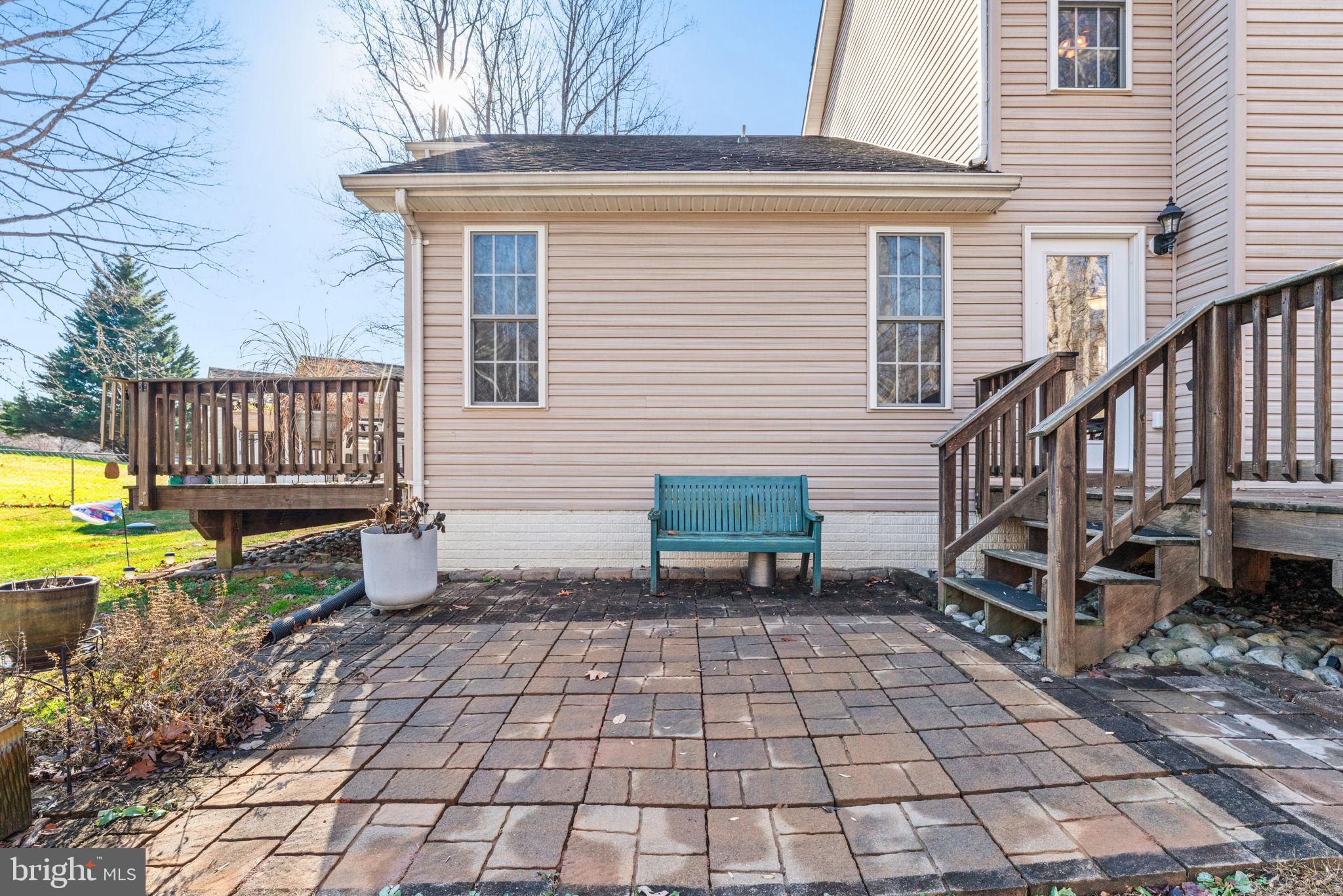 12376 Robin Road Culpeper, VA 22701 - Photo 60 of 70 a view of a chairs setting on the deck in front of house