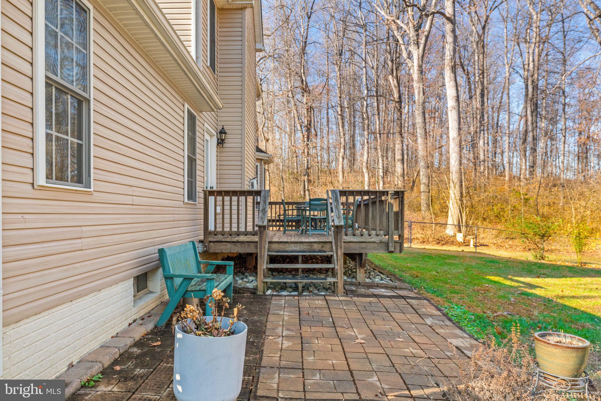 12376 Robin Road Culpeper, VA 22701 - Photo 61 of 70 a patio with table and chairs and potted plants