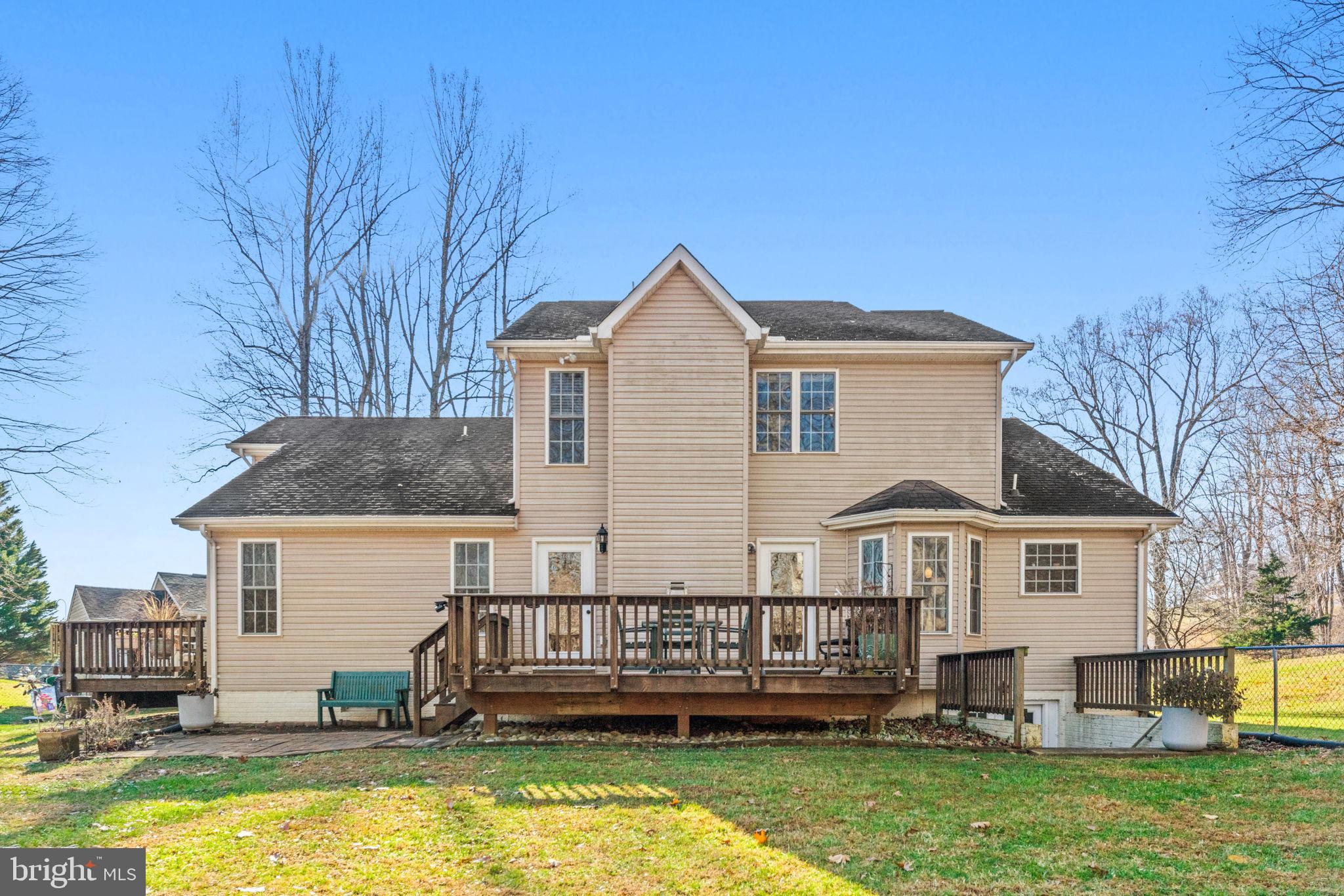 12376 Robin Road Culpeper, VA 22701 - Photo 66 of 70 a front view of a house with a yard table and chairs