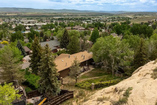 an outdoor sitting area with furniture and wooden floor