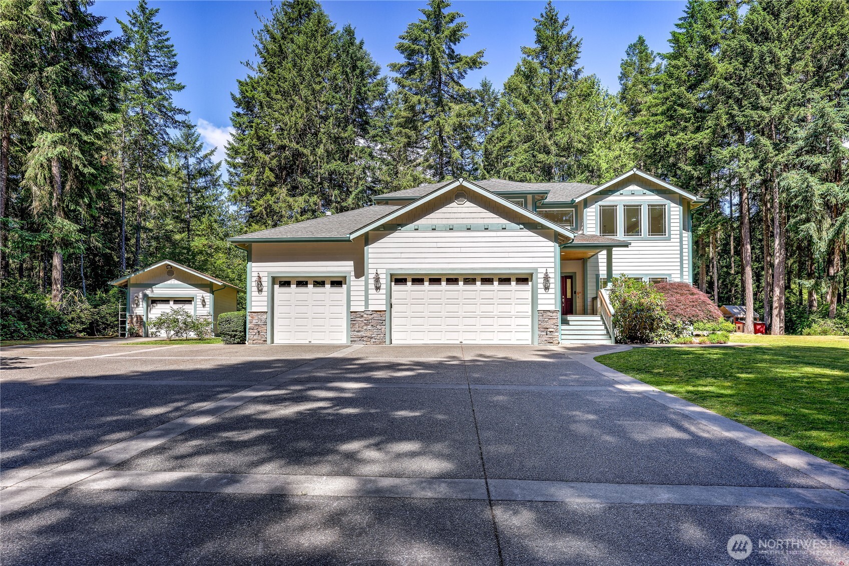 4354 Northwest Westgate Road Silverdale, WA 98383 - Photo 39 of 40 a front view of a house with a garden and trees