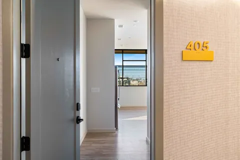 a view of an entryway with wooden floor