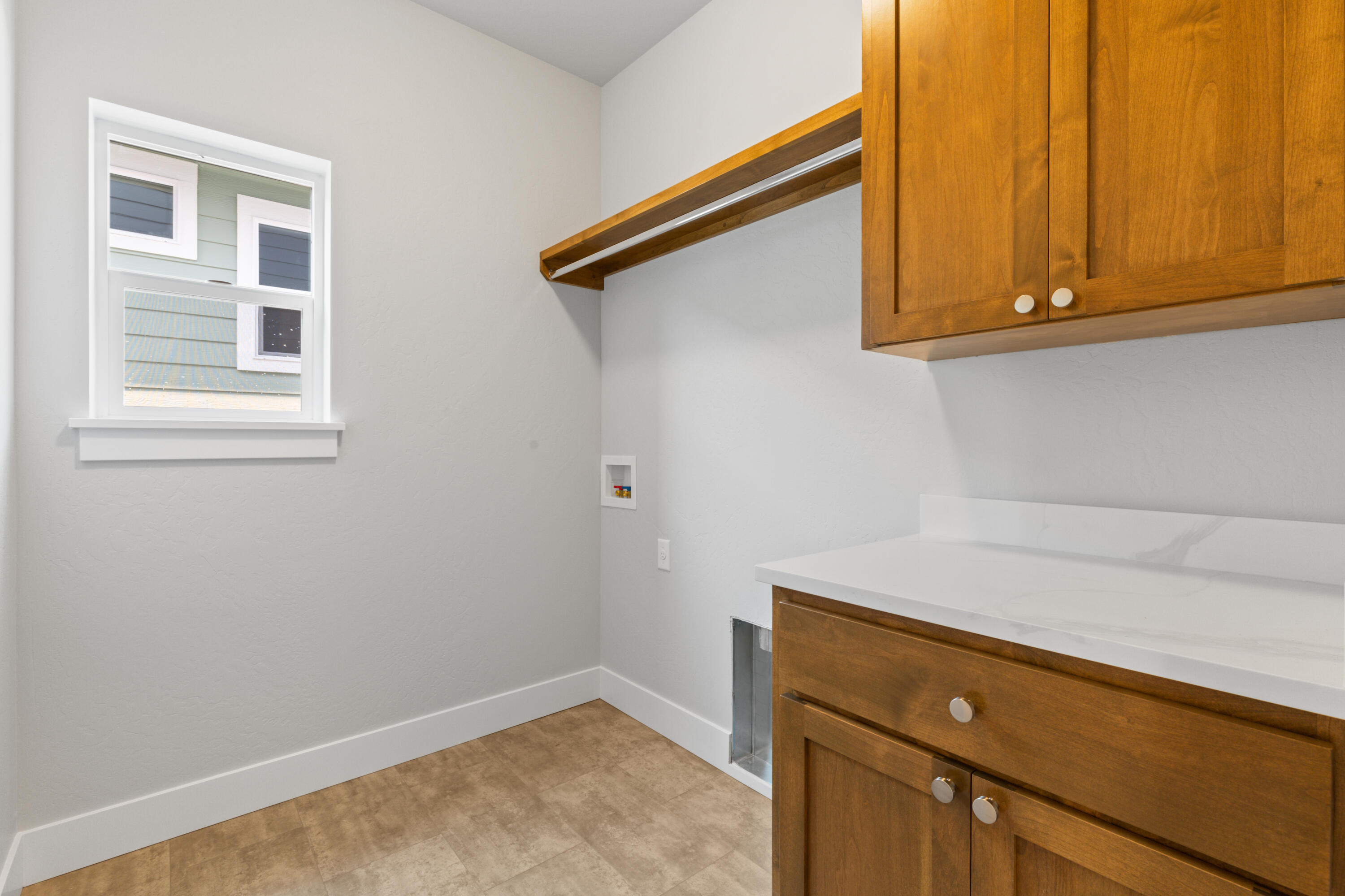220 Autumn Ridge Road Talent, OR 97540 - Photo 22 of 27 Across from mudroom, laundry has additional storage and hanging space.