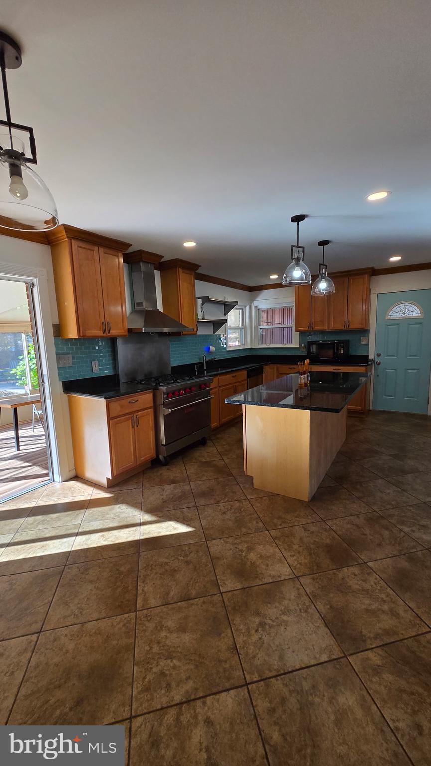 2105 Calhoun Street Fort Washington, MD 20744 - Photo 8 of 13 a kitchen with stainless steel appliances granite countertop a sink and a stove