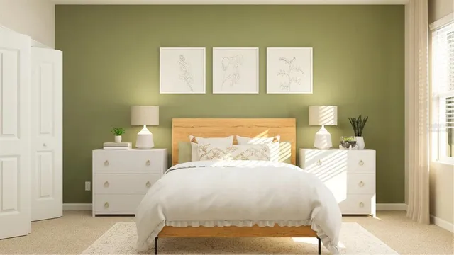 a bedroom with a bed and a cabinets