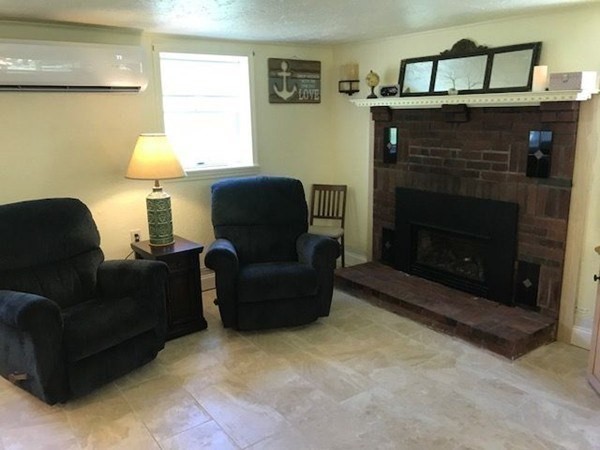 90 Lookout Point Road Plymouth, MA 02360 - Photo 3 of 10 a living room with furniture and a fireplace