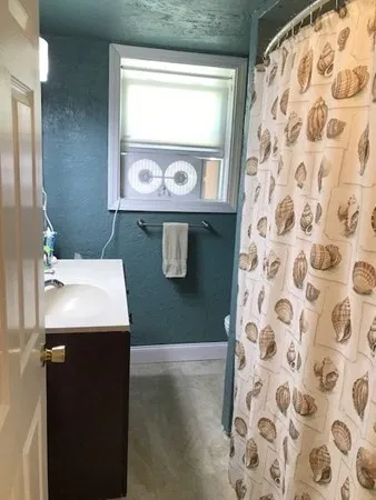 a bathroom with a sink and mirror