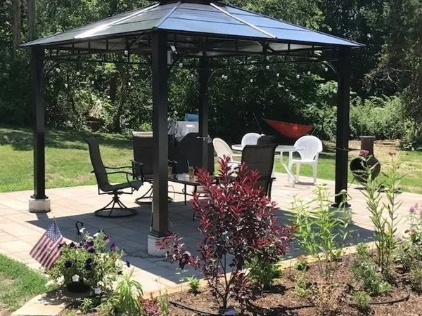 a view of yard with patio