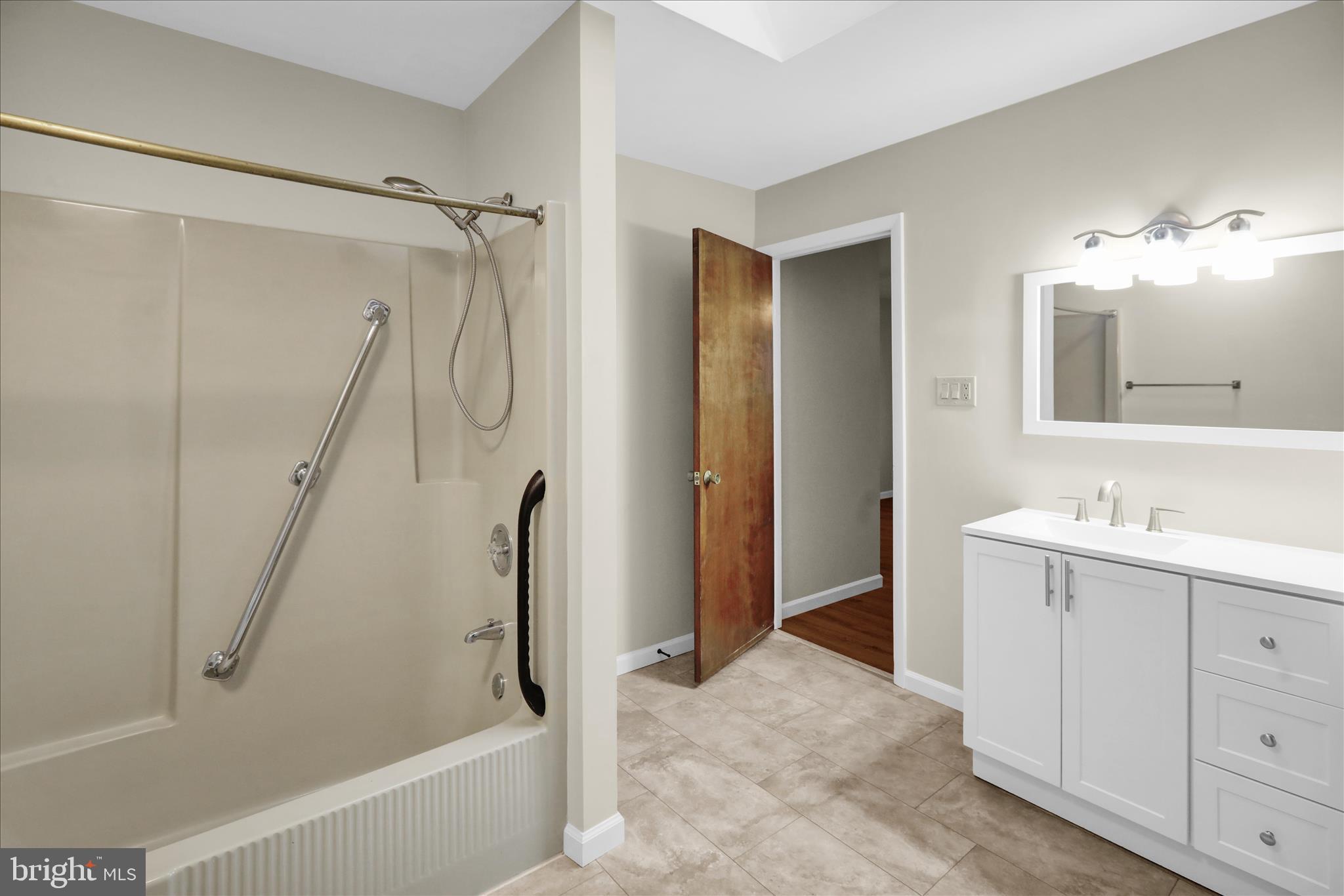 1613 Shoey Road, Unit A Mohrsville, PA 19541 - Photo 11 of 17 a bathroom with a sink vanity granite tub and shower