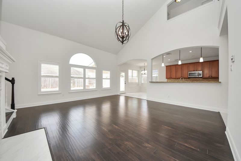 20831 Deauville Drive Spring, TX 77388 - Photo 14 of 42 Another view of the "walls of windows" in the family room and kitchen. Check out the custom windows and plantation shutters!