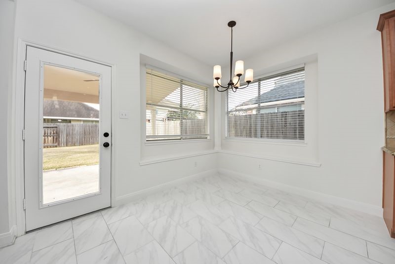 20831 Deauville Drive Spring, TX 77388 - Photo 22 of 42 The breakfast room has access to the back yard and covered porch.