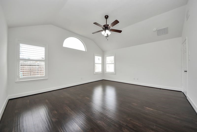 20831 Deauville Drive Spring, TX 77388 - Photo 25 of 42 High ceilings, tons of natural light & plantation shutters adorn this primary suite.