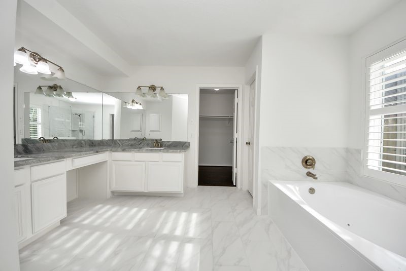 20831 Deauville Drive Spring, TX 77388 - Photo 27 of 42 Fully renovated primary bath with double sinks and vanity.