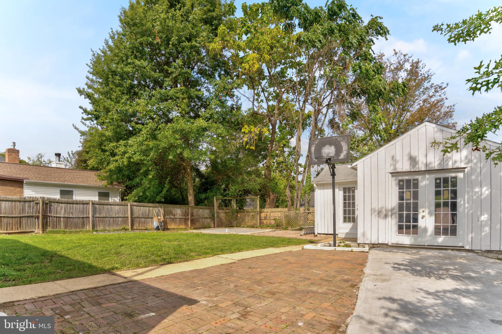 3106 Burgundy Road Alexandria, VA 22303 - Photo 20 of 24 a view of a house with a backyard