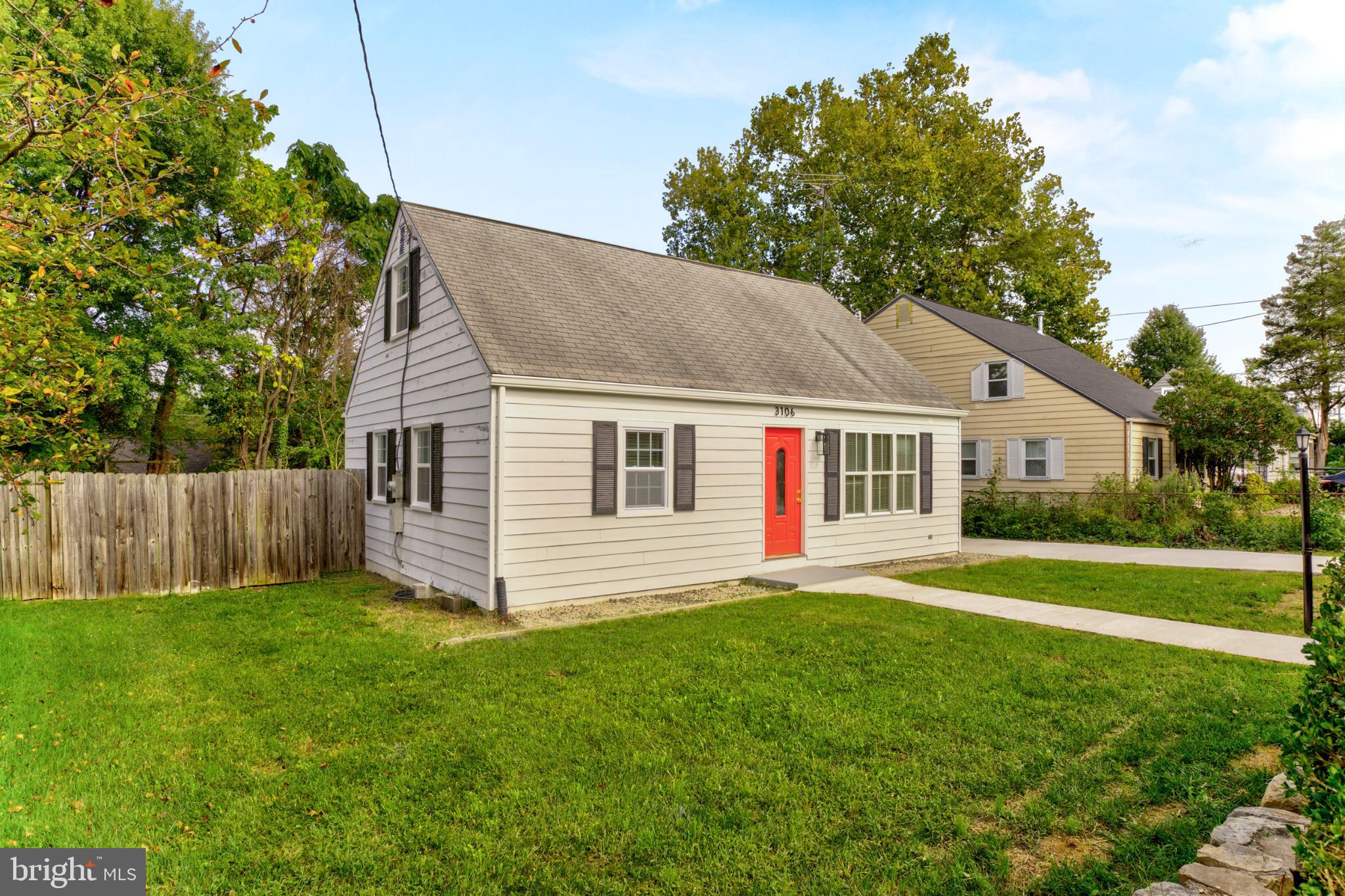 3106 Burgundy Road Alexandria, VA 22303 - Photo 2 of 24 a front view of house with yard and green space