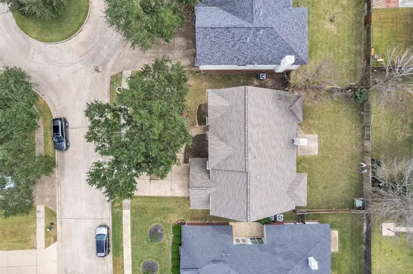 an aerial view of a house with outdoor space