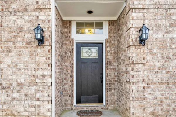 a bathroom with a shower and a sink
