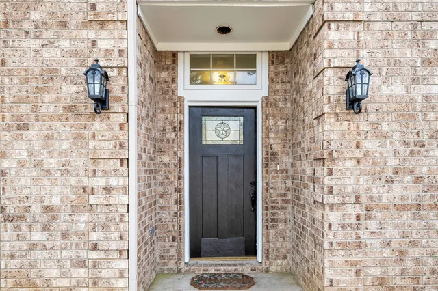 a bathroom with a shower and a sink