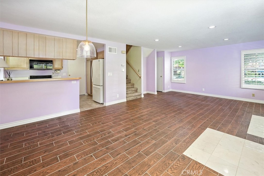 22713 Copper Hill Drive, Unit 42 Saugus, CA 91350 - Photo 11 of 32 a view of a kitchen with a sink and a window