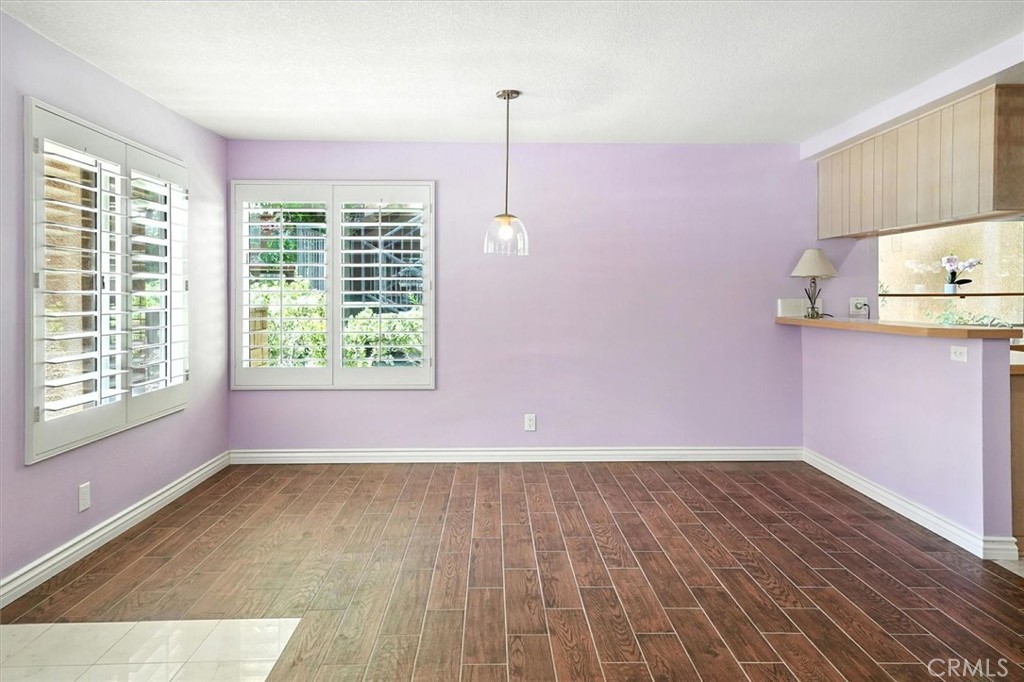 22713 Copper Hill Drive, Unit 42 Saugus, CA 91350 - Photo 13 of 32 a view of a room with wooden floor and windows