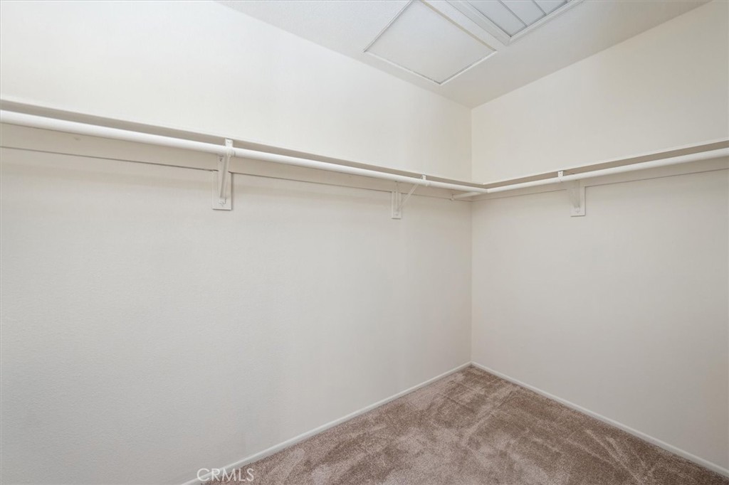 22713 Copper Hill Drive, Unit 42 Saugus, CA 91350 - Photo 23 of 32 a view of an empty walk in closet
