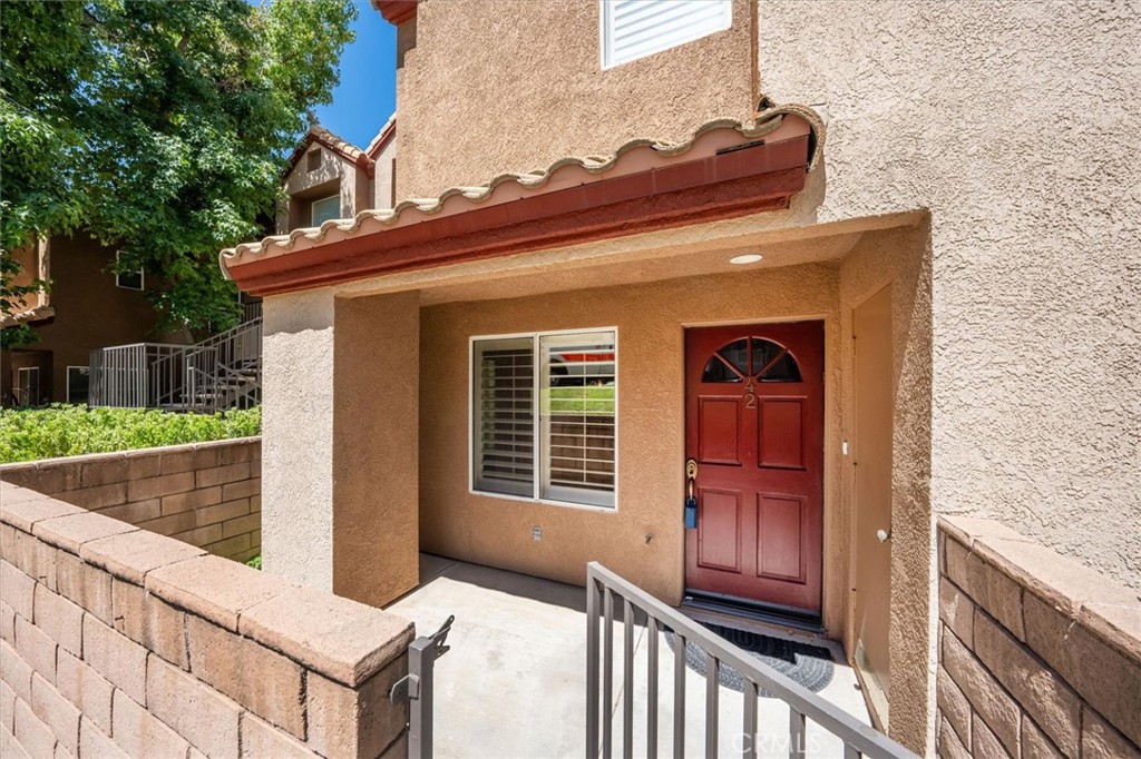 22713 Copper Hill Drive, Unit 42 Saugus, CA 91350 - Photo 5 of 32 a view of front door of house