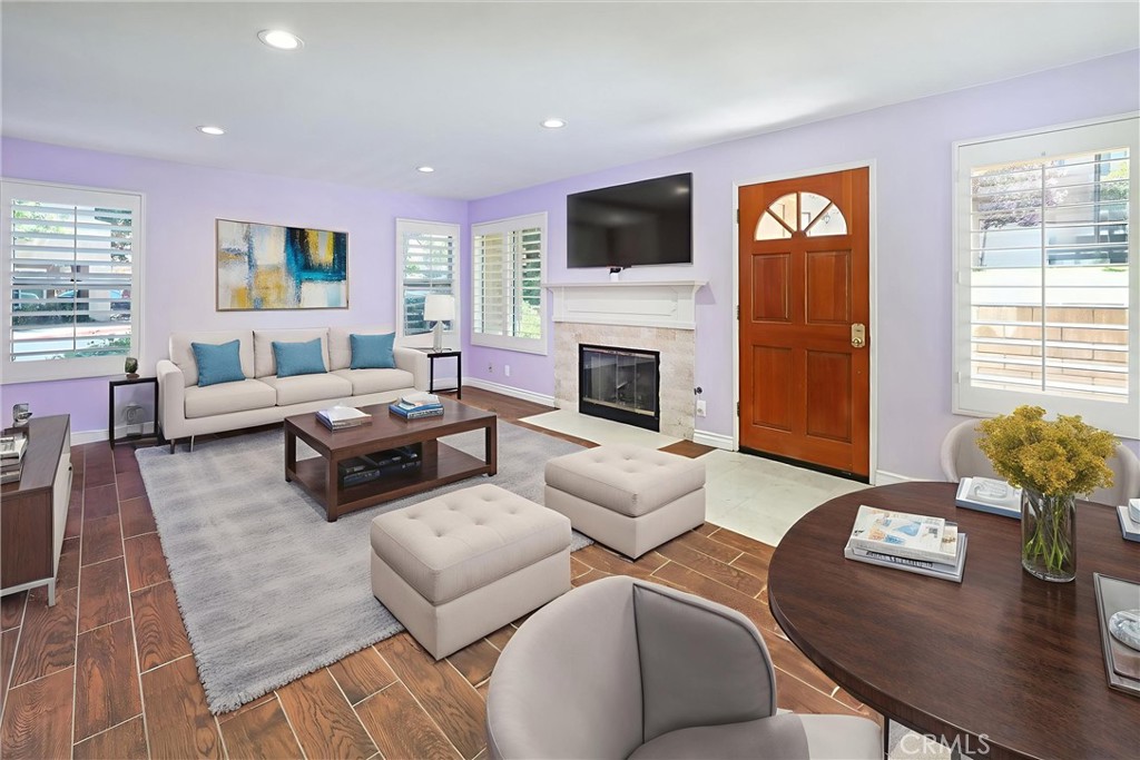 22713 Copper Hill Drive, Unit 42 Saugus, CA 91350 - Photo 7 of 32 a living room with furniture fireplace and window
