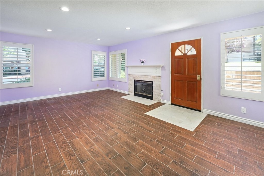 22713 Copper Hill Drive, Unit 42 Saugus, CA 91350 - Photo 8 of 32 an empty room with windows and fireplace
