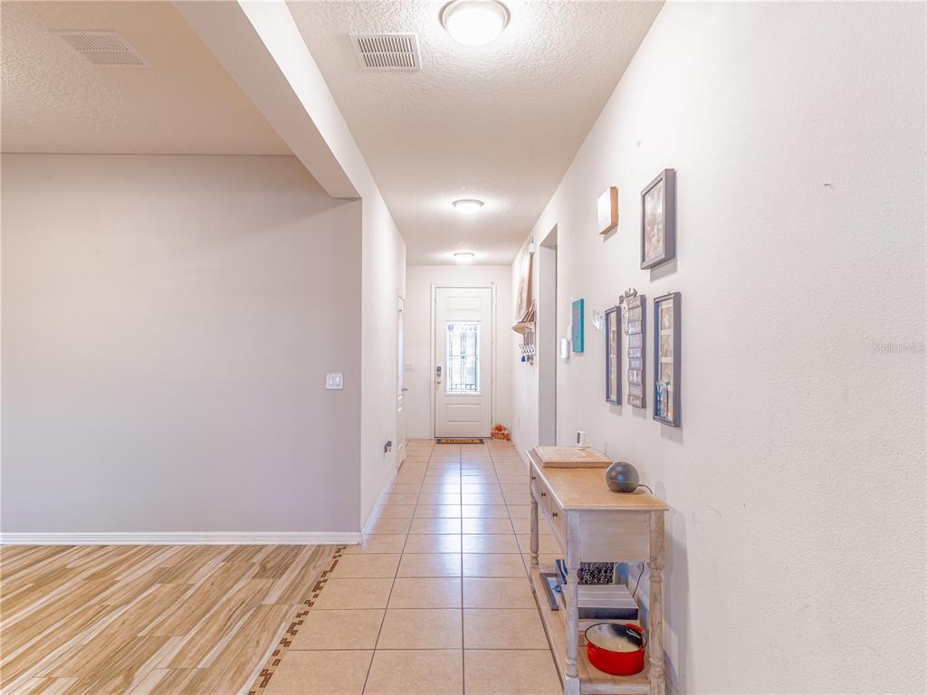 4504 Orchard Grove Road St. Cloud, FL 34772 - Photo 9 of 29 a view of a hallway with interior of the house