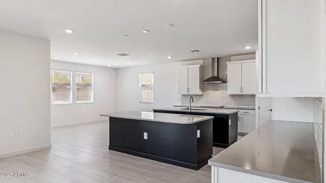 a kitchen that has a sink and a stove