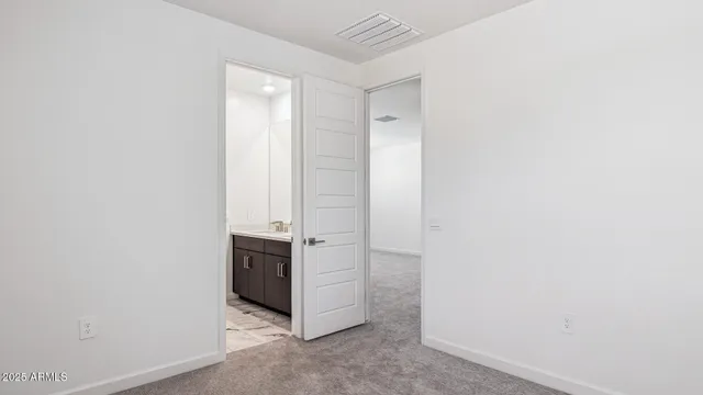 a bathroom with a shower and a sink