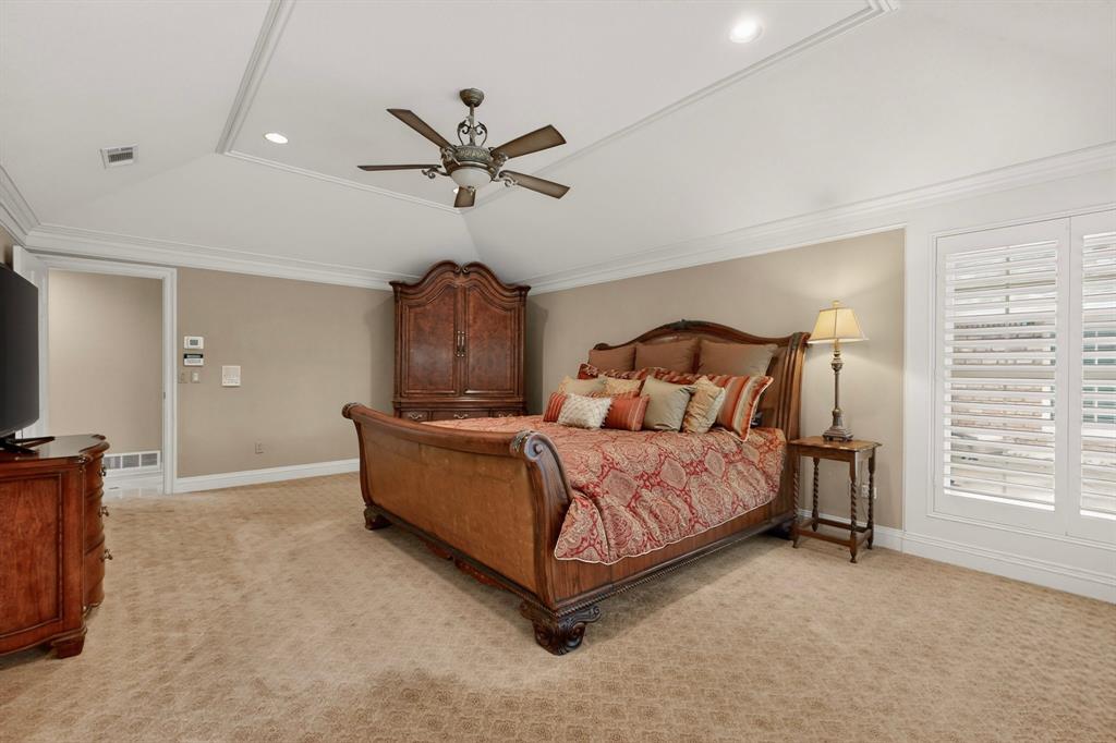 2405 Wing Point Lane Plano, TX 75093 - Photo 20 of 39 a bedroom with a bed and a television
