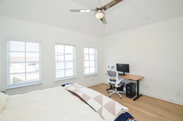 a spacious bathroom with a double vanity sink mirror and bathtub